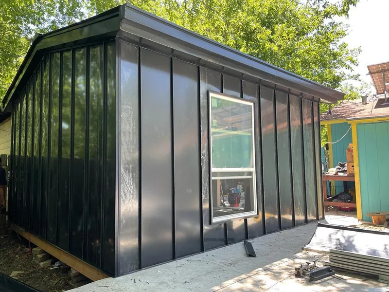 Black standing seam metal wall panels for Metal Roof Installation in Ettrick