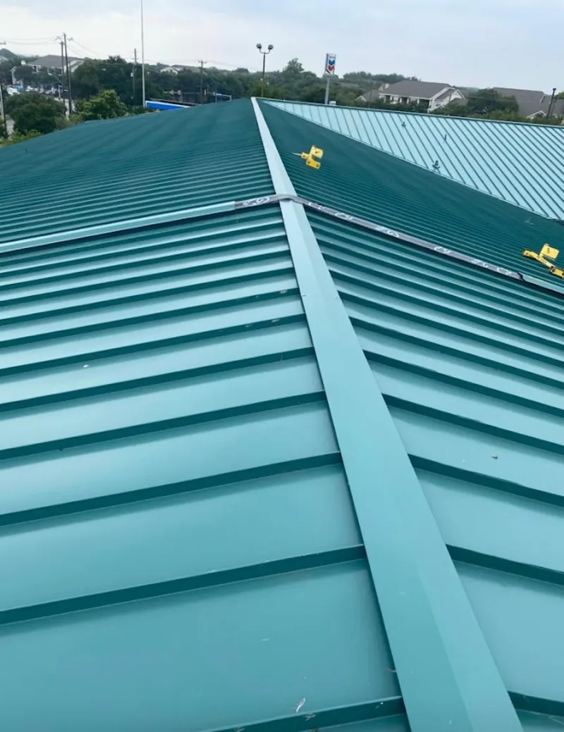 Green commercial metal roof ridge and valley for Metal Roof Repair in Ettrick